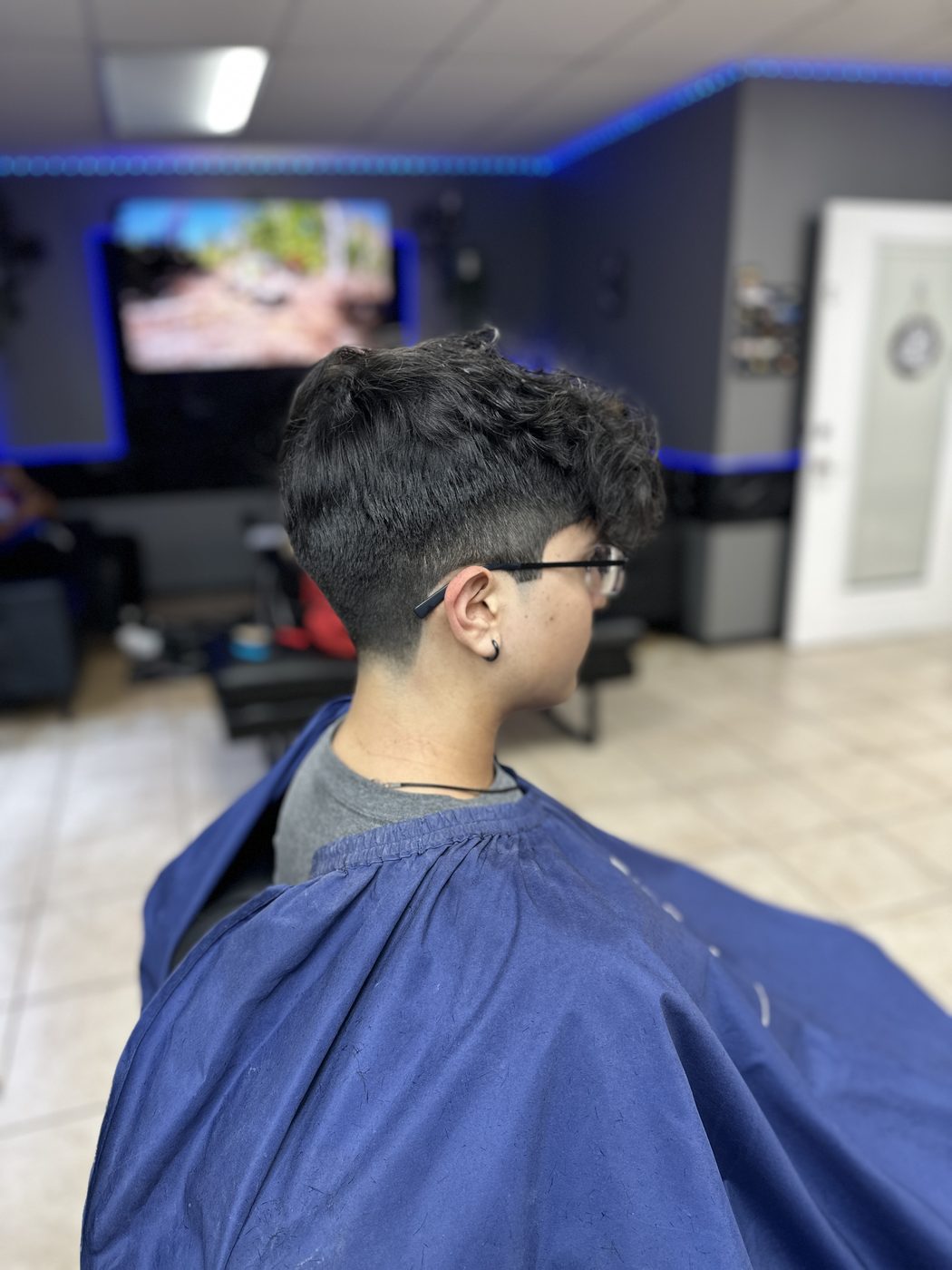 Textured curly top with taper