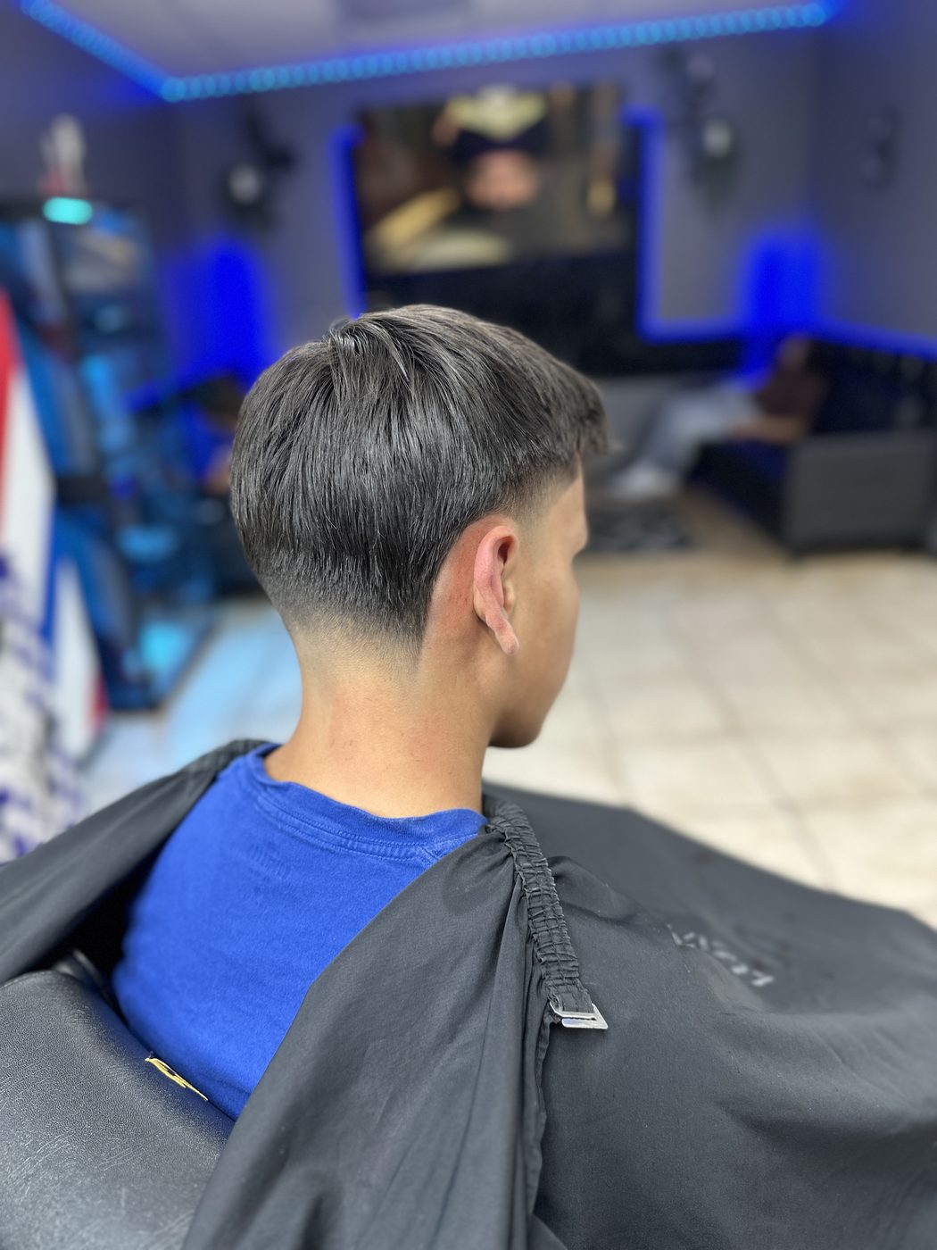 Clean tapered fade — back view
